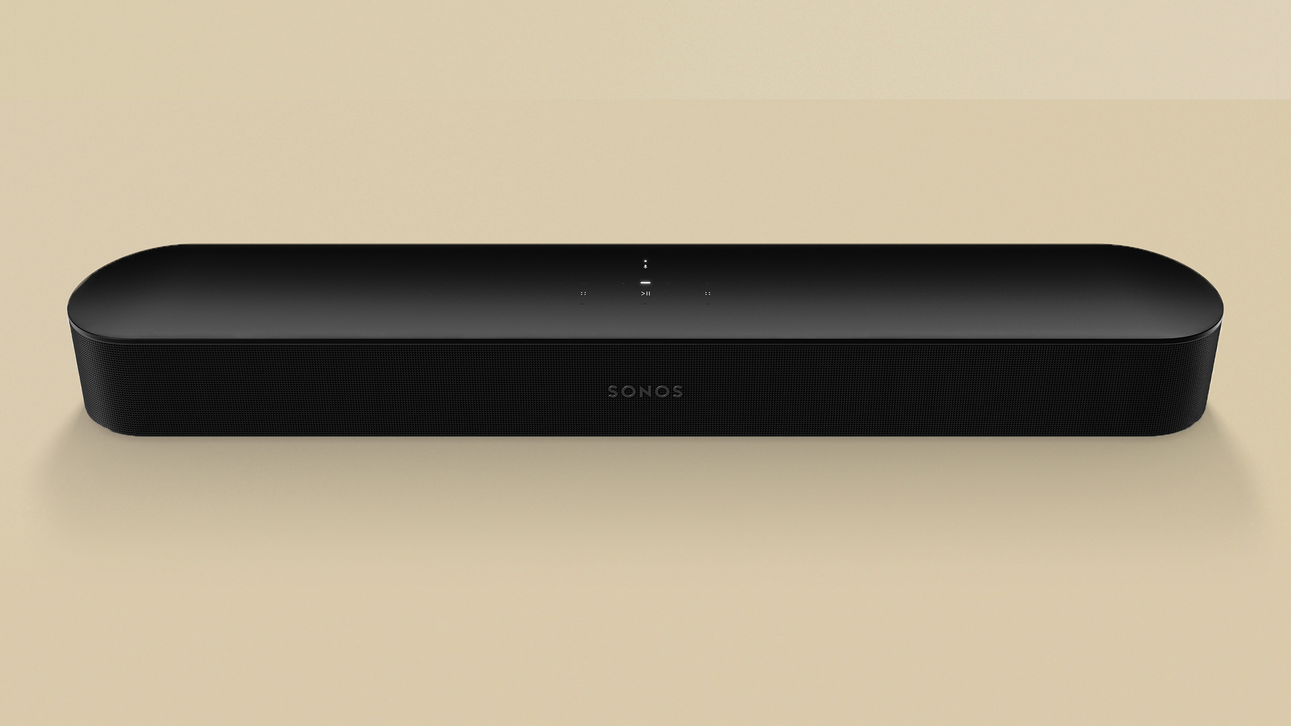 Обзор Sonos Beam 2nd Gen, устройство черного цвета на желтом фоне